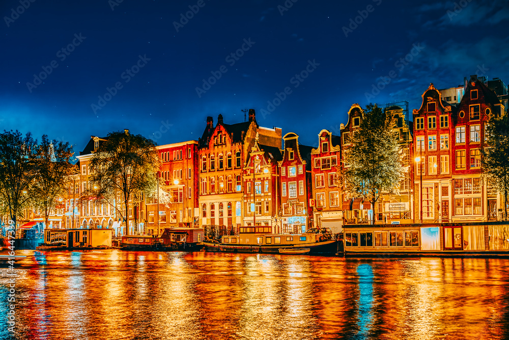 Obraz premium Famous Amstel river and night view of beautiful Amsterdam city. Netherlands