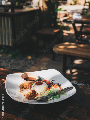 Spicy Rice Salad with Vegetable,Khao Yum, Thai food, Southern food Steamed rice, assorted vegetables, split bean sprouts, carrots, fish meal, fried noodles mixed together and topped with salted sauce.