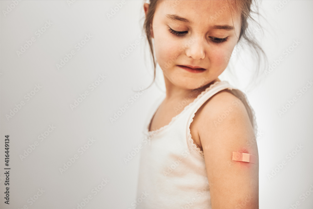 Little girl feeling pain having some side effects after vaccination ...