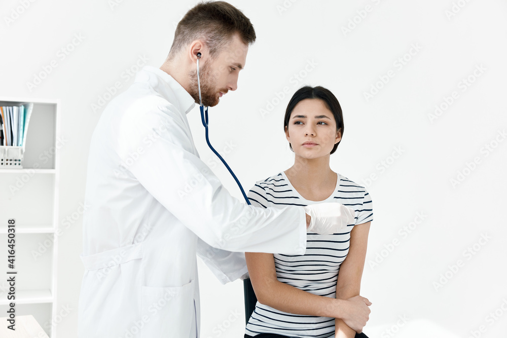 male doctor examines patient in hospital health male doctor examines patient in hospital health