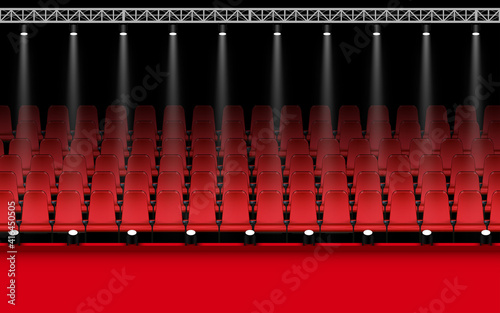 red stage with spotlight and red seats in the hall