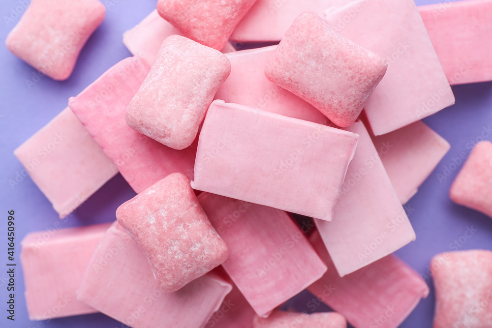 Chewing gums on color background