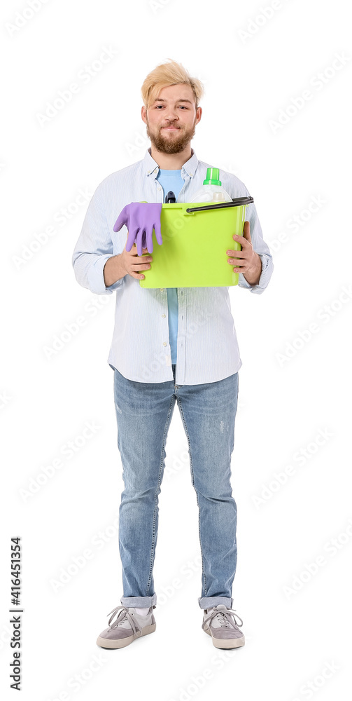 Young man with cleaning supplies on white background Young man with cleaning supplies on white background