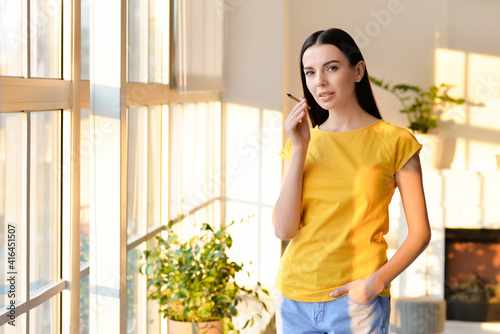 Young woman smoking cigaret...