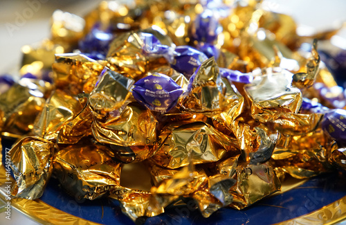 Many candies wrapped in gold