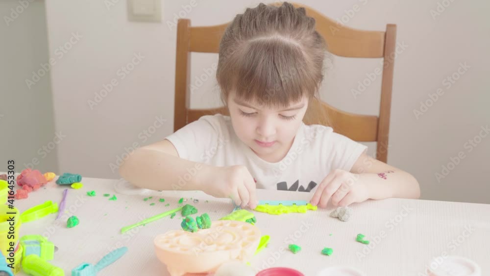 Little girl playing with plasticine Little girl playing with plasticine