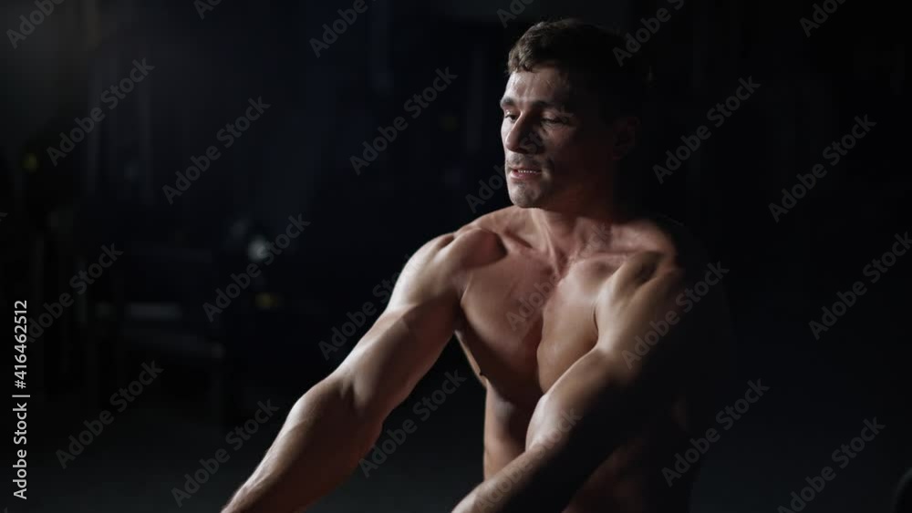 Athletic man in the Gym lifting blocks on rowing machine, training on block device and gym equipment, 4k Slow Motion. Athletic man in the Gym lifting blocks on rowing machine, training on block device and gym equipment, 4k Slow Motion.