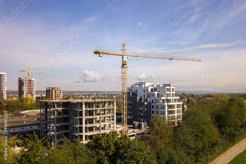 Aerial view of high residential apartment buildings under construction. Real estate development.