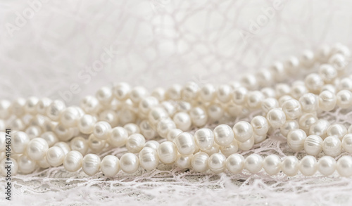 Nature white string of pearls in soft focus, with highlights