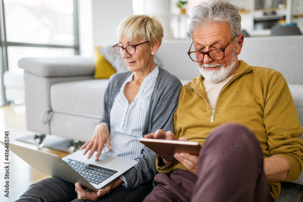 Happy romantic senior couple hugging and enjoying retirement at home Happy romantic senior couple hugging and enjoying retirement at home