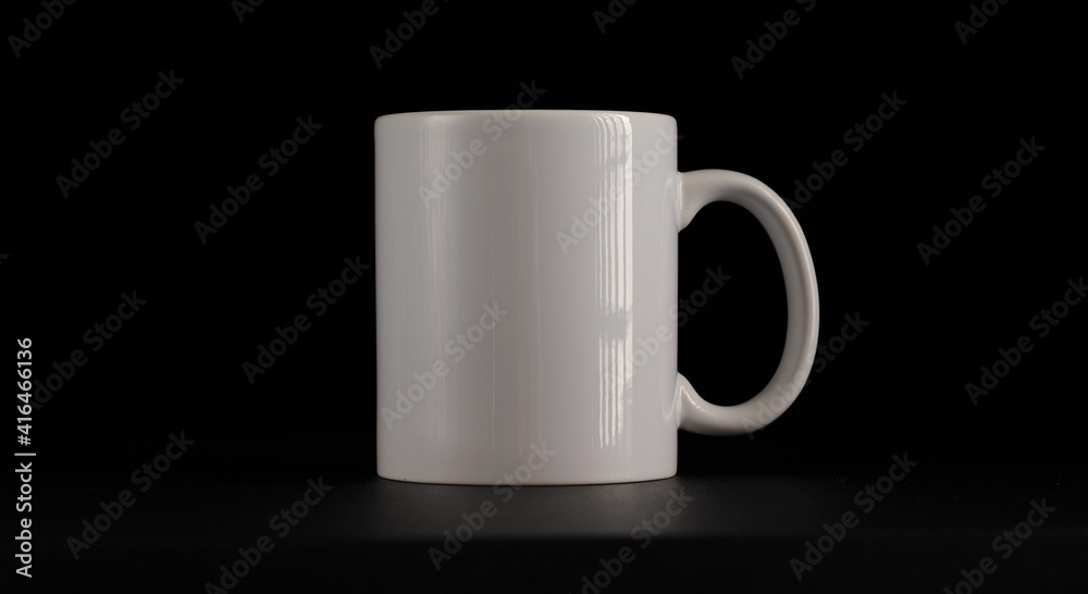 Fototapeta premium white mug on black background.