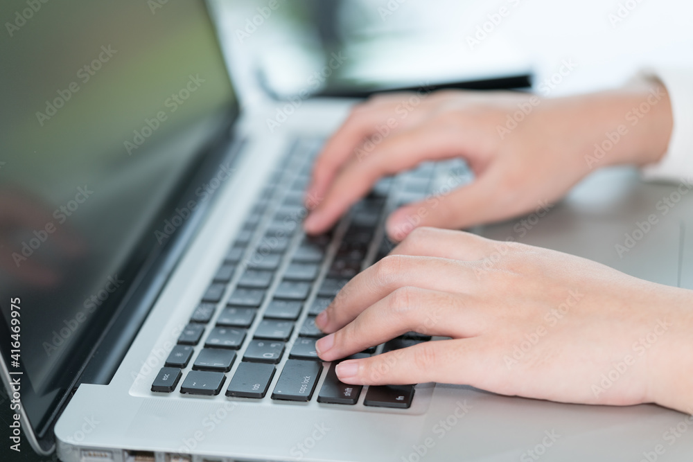 Closeup woman hand using computer laptop. Using online connect technology for business, education and communication. Closeup woman hand using computer laptop. Using online connect technology for business, education and communication.