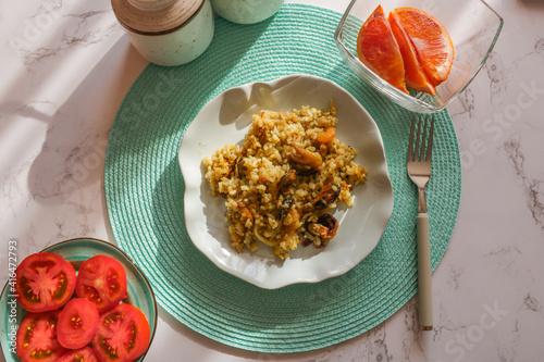 Italian risotto with seafood, food flat lay.