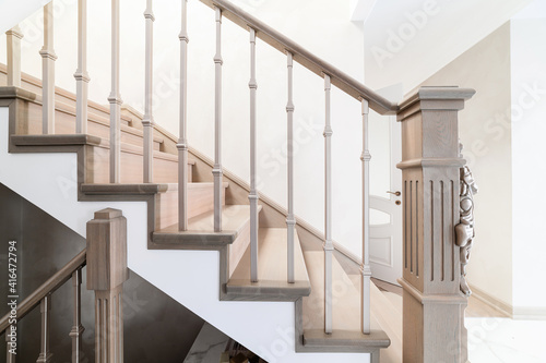 Handmade railings and stairs made of wood in the house