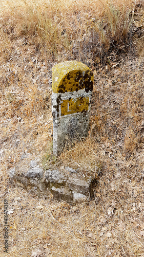 old kilometric point of concrete on a road