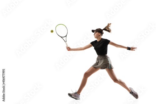 Catching. Young caucasian professional sportswoman playing tennis isolated on white background. Training, practicing in motion, action. Power and energy. Movement, ad, sport, healthy lifestyle concept © master1305