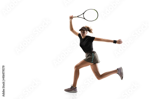 Running. Young caucasian professional sportswoman playing tennis isolated on white background. Training, practicing in motion, action. Power and energy. Movement, ad, sport, healthy lifestyle concept. © master1305