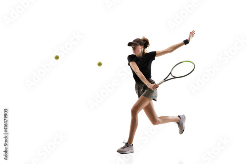 Youth. Young caucasian professional sportswoman playing tennis isolated on white background. Training, practicing in motion, action. Power and energy. Movement, ad, sport, healthy lifestyle concept. © master1305