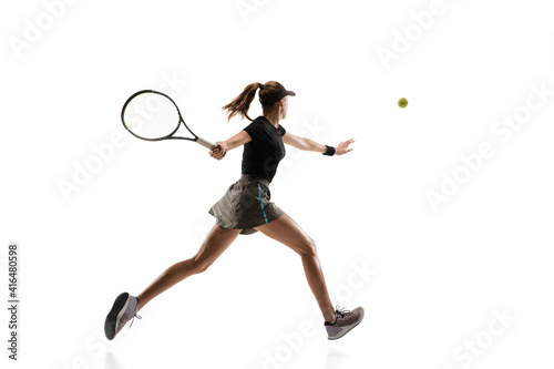 On fire. Young caucasian professional sportswoman playing tennis isolated on white background. Training, practicing in motion, action. Power and energy. Movement, ad, sport, healthy lifestyle concept.