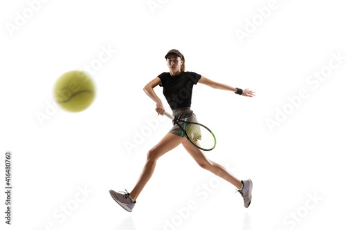 Champion. Young caucasian professional sportswoman playing tennis isolated on white background. Training, practicing in motion, action. Power and energy. Movement, ad, sport, healthy lifestyle concept
