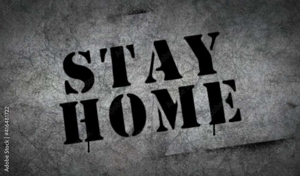 Stay home spray painted inscription on the concrete wall Stay home spray painted inscription on the concrete wall