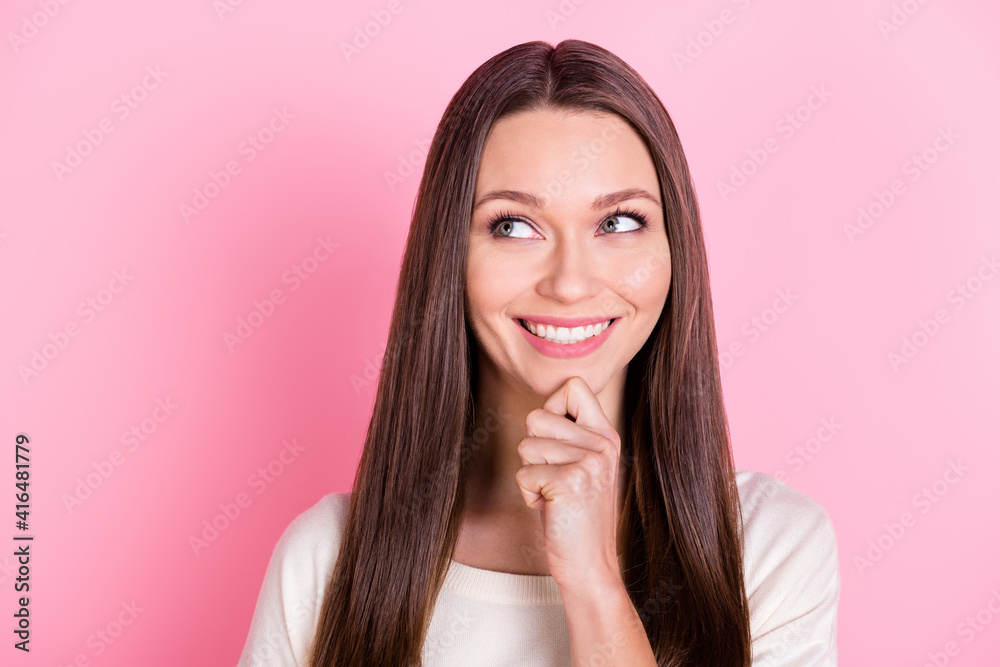 Portrait of charming cheerful person hand finger chin look interested empty space isolated on pink color background Portrait of charming cheerful person hand finger chin look interested empty space isolated on pink color background