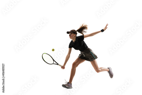 Competitive. Young caucasian professional sportswoman playing tennis on white background. Training, practicing in motion, action. Power and energy. Movement, ad, sport, healthy lifestyle concept.