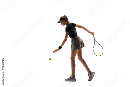 Walk over. Young caucasian professional sportswoman playing tennis isolated on white background. Training, practicing in motion, action. Power and energy. Movement, ad, sport, healthy lifestyle
