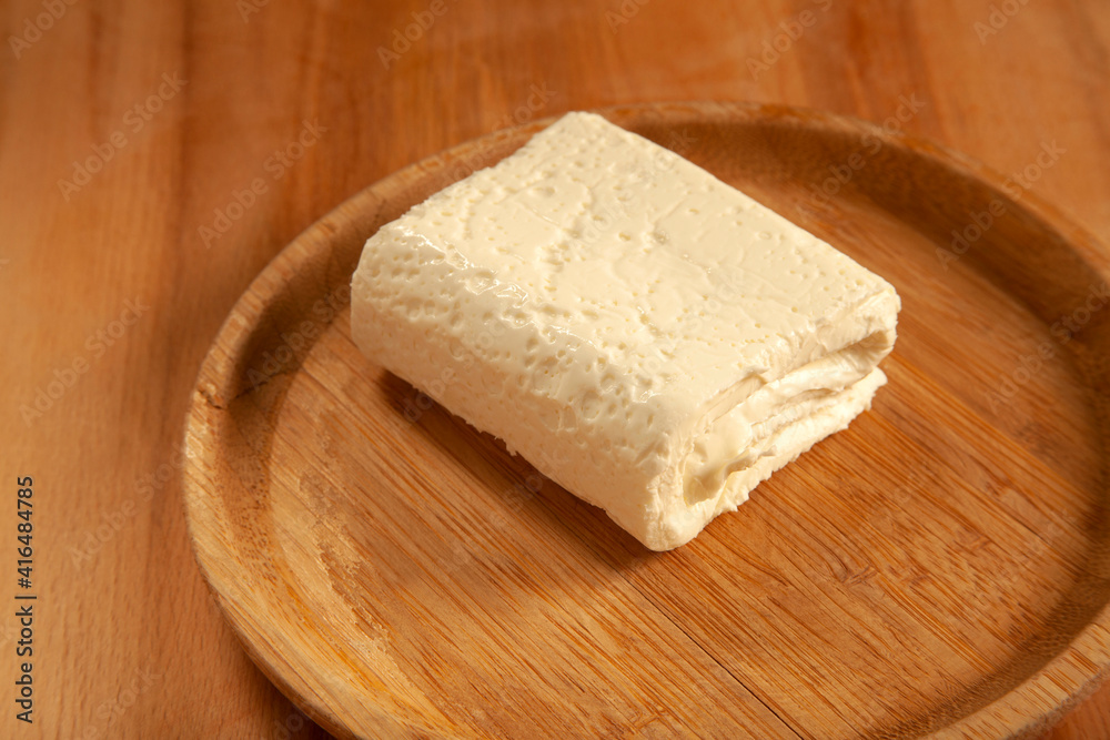  feta cheese in bamboo plate