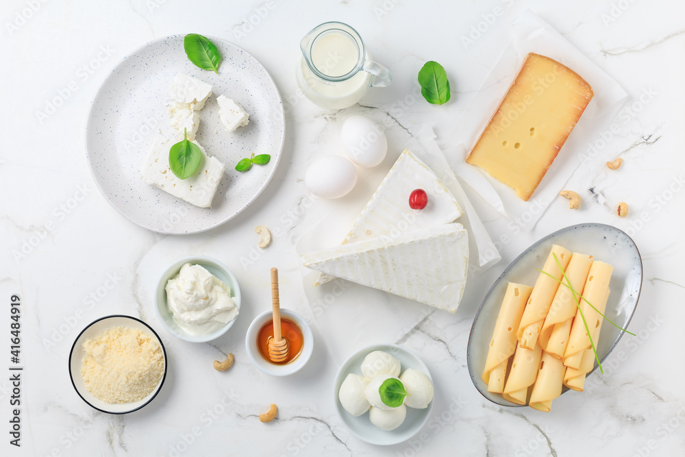Fresh dairy products on white marble background. Fresh dairy products on white marble background.