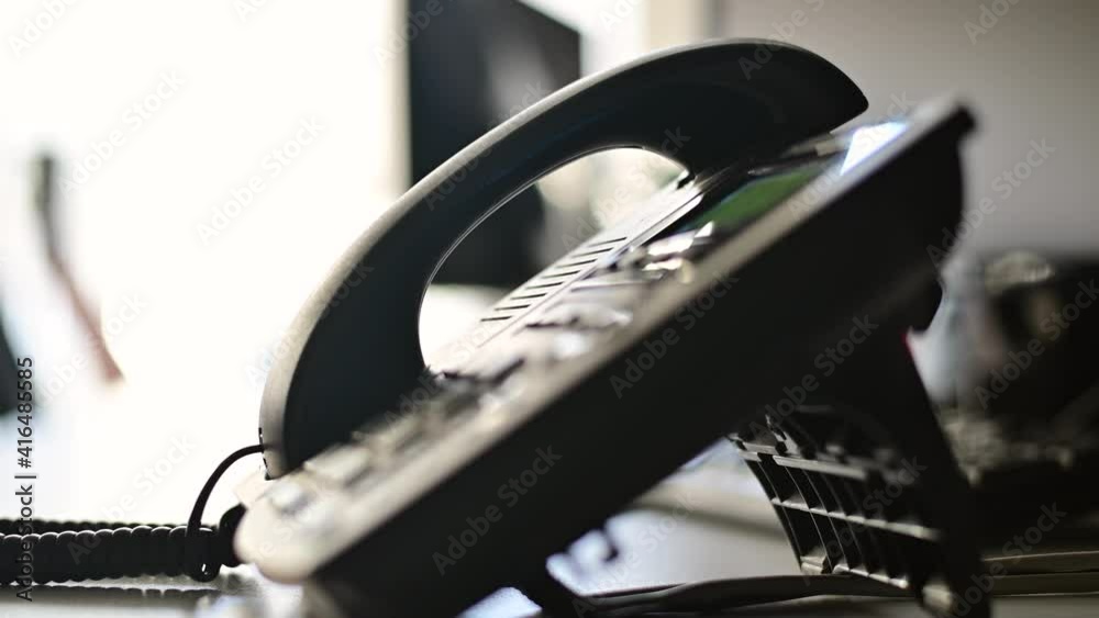 Closeup of the hand of a female office worker rejects a call on the