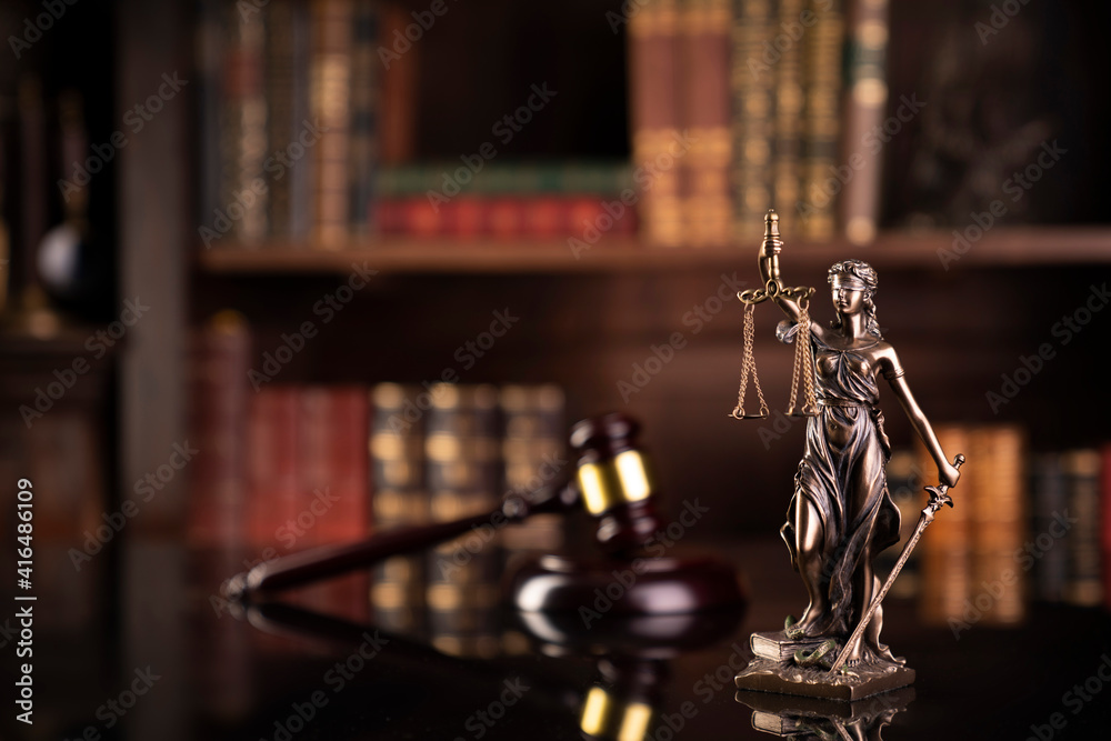Law theme. Judge chamber. Judge’s gavel, Themis sculpture and