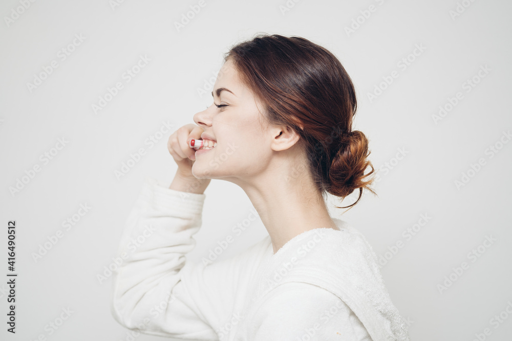 pretty woman in white coat toothbrush health hygiene