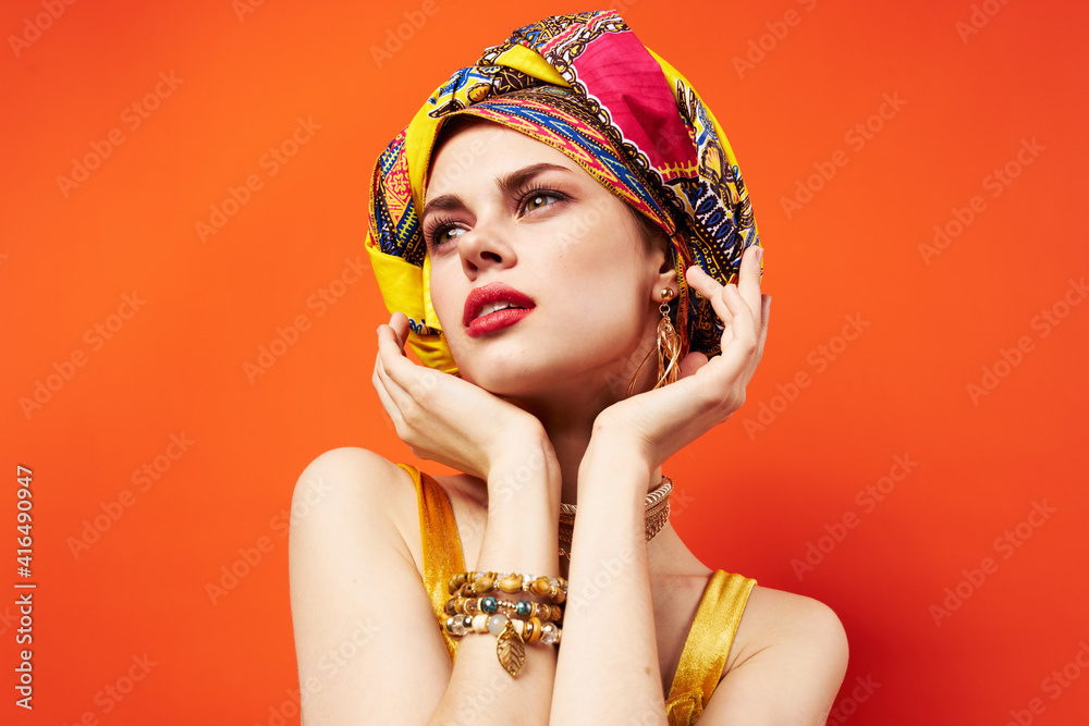 woman with multicolored turban on her head half cosmetics decoration isolated background woman with multicolored turban on her head half cosmetics decoration isolated background