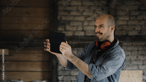 Worker taking pictures of construction site