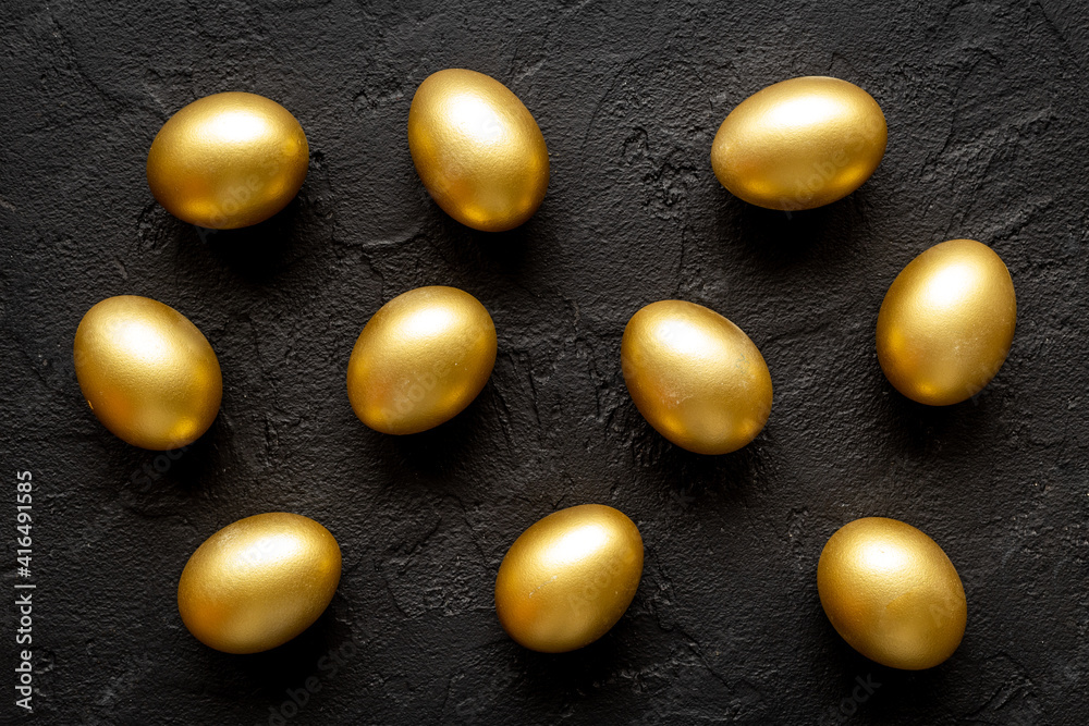 Pattern of golden eggs. Easter decoration. Wealth and good luck concept. Overhead view