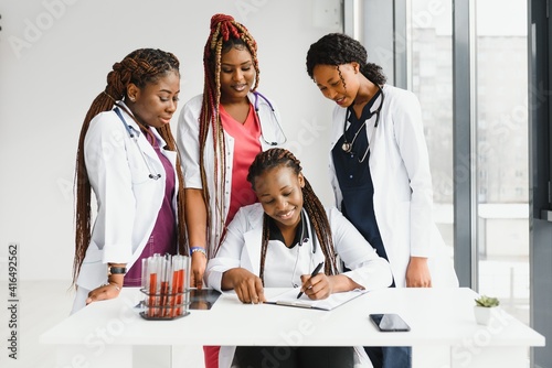 group of young african medical workers on white background