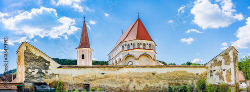 Medieval evangelical saxon fortified church of Cloasterf village in Mures county, Transylvania, Romania photo