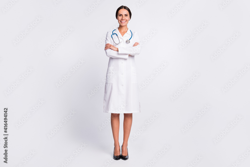 Photo of good mood cheerful young woman therapist wear formal coat smiling arms crossed isolated white color background Photo of good mood cheerful young woman therapist wear formal coat smiling arms crossed isolated white color background