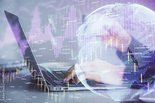 Double exposure of businesswoman hands typing on computer and forex graph hologram drawing. Financial analysis concept.