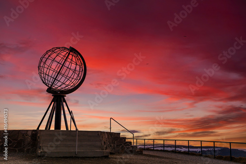 Symbolic globe at the North Cape at sunset. Nordkapp, Norway photo