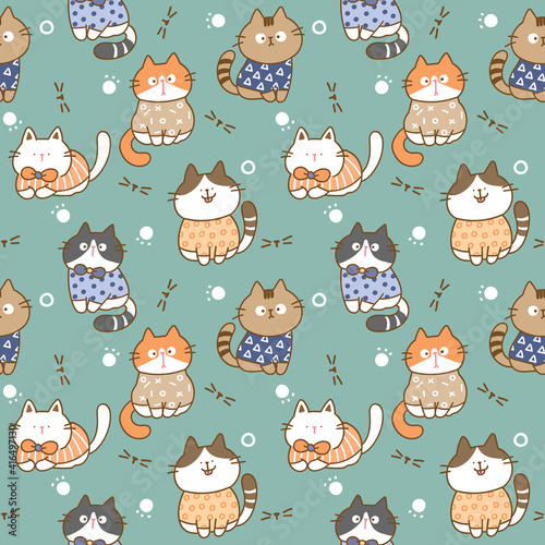 Seamless Pattern with Cartoon Cat Illustration Design on Green Background