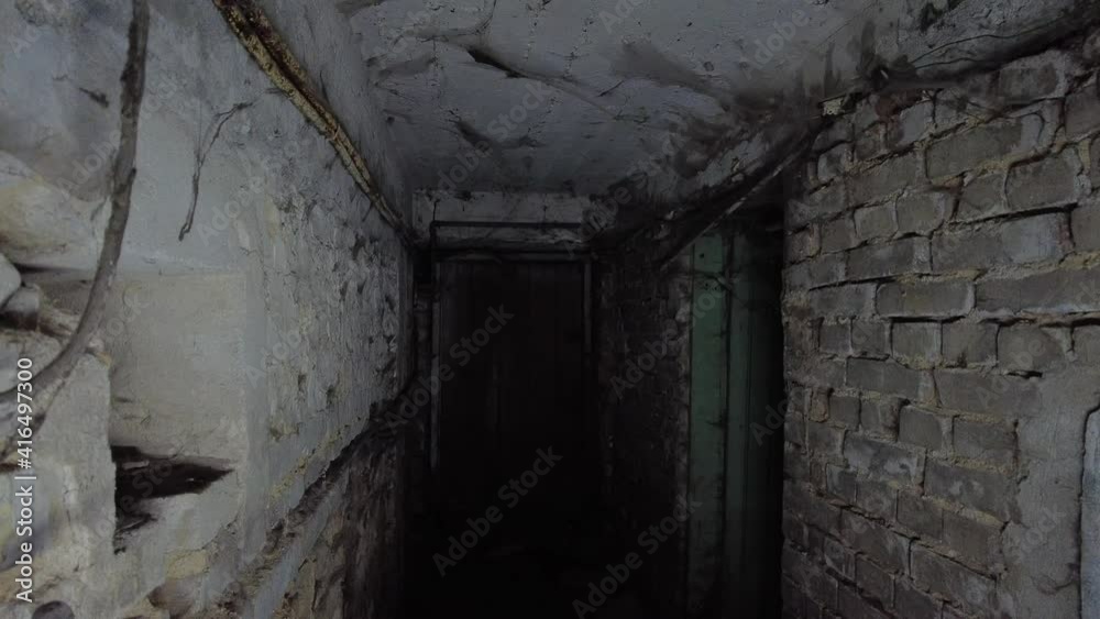 Flashlight in Scary underground, basement. Old abandoned warehouses in a dungeons. Flashlight in Scary underground, basement. Old abandoned warehouses in a dungeons.
