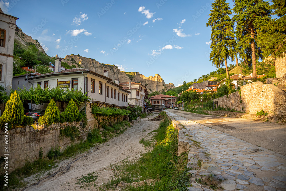 MELNIK, BULGARIA - JUNE 01, 2018: Typical street and old houses in historical town of Melnik, Blagoevgrad region, Bulgaria.