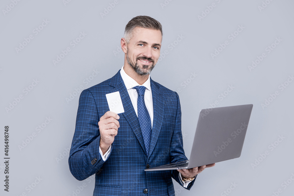 Tradesman hold card and laptop. Business communication. Virtual communication Tradesman hold card and laptop. Business communication. Virtual communication