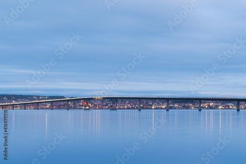 Wallpaper Mural Vallsundsbron bridge over Lake Storsjön with the city of Östersund in the background just after sunset Torontodigital.ca