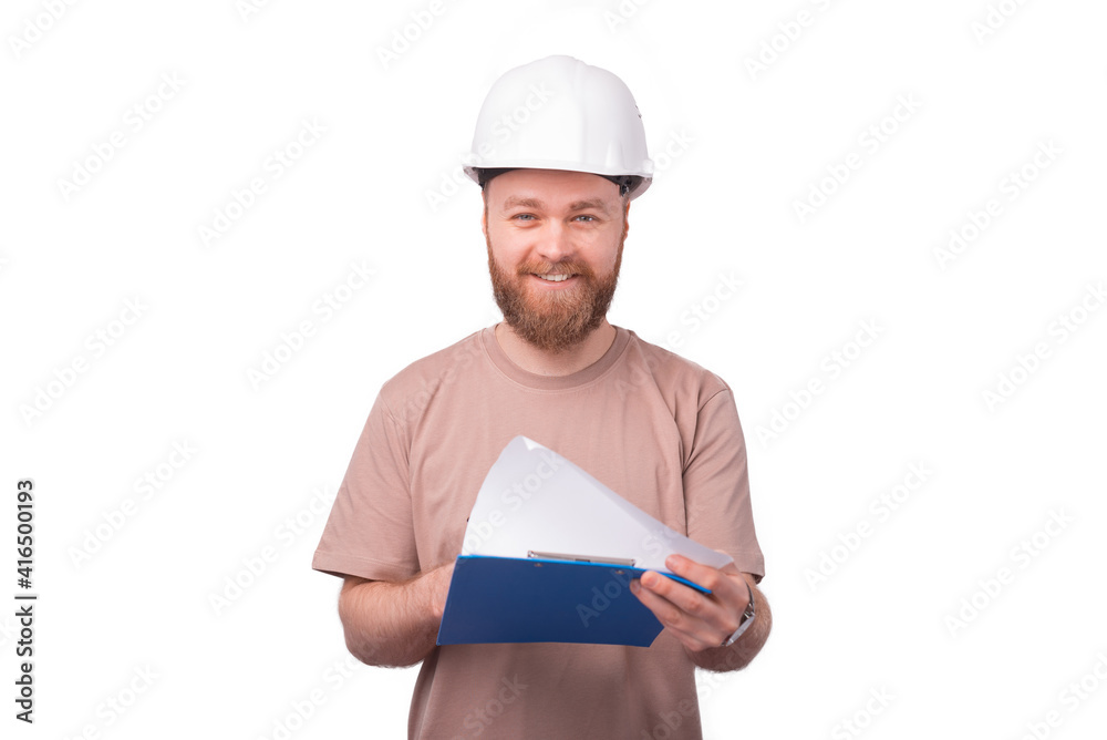 Photo of smiling architect looking at sketches over white background Photo of smiling architect looking at sketches over white background