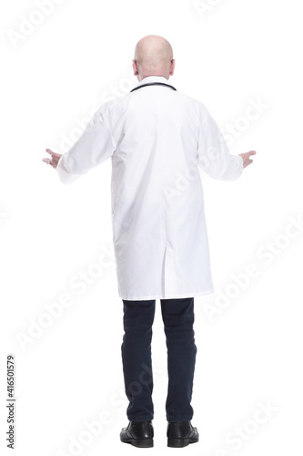 rear view. male doctor looking at a white blank screen .