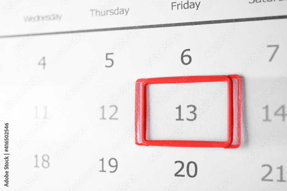 Closeup view of calendar page, focus on Friday 13. Bad luck superstition Closeup view of calendar page, focus on Friday 13. Bad luck superstition