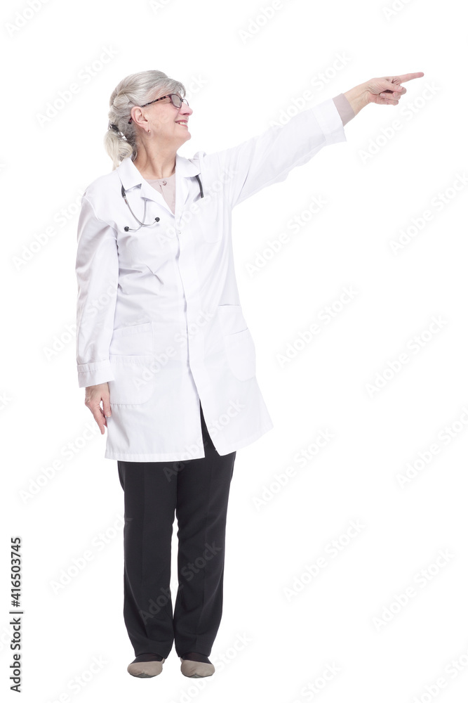 smiling woman doctor pointing at a white screen.